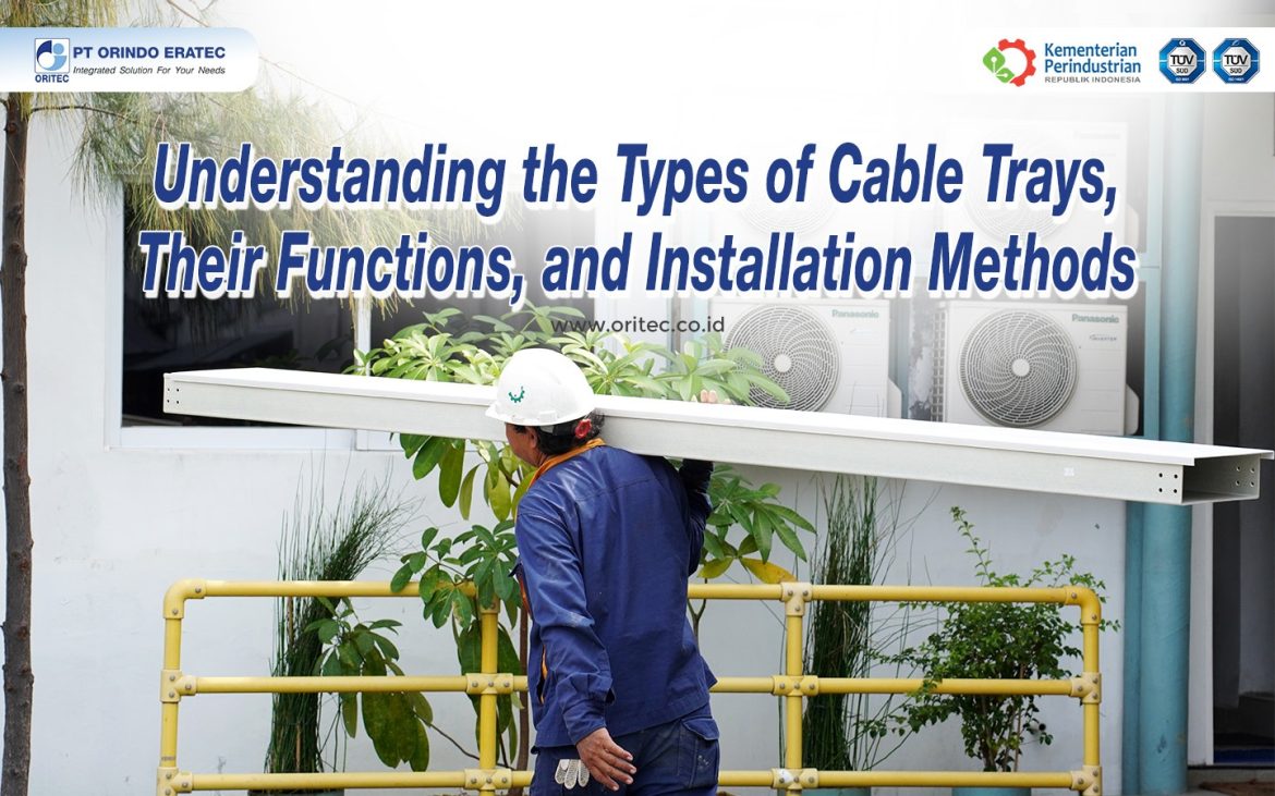 Construction worker in blue coveralls carries a metal beam in front of a large banner about cable trays installation.